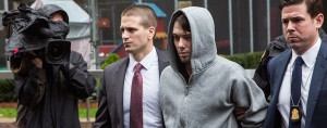 Martin Shkreli, Chief Executive of KaloBios Pharmaceuticals, is led away by security officials